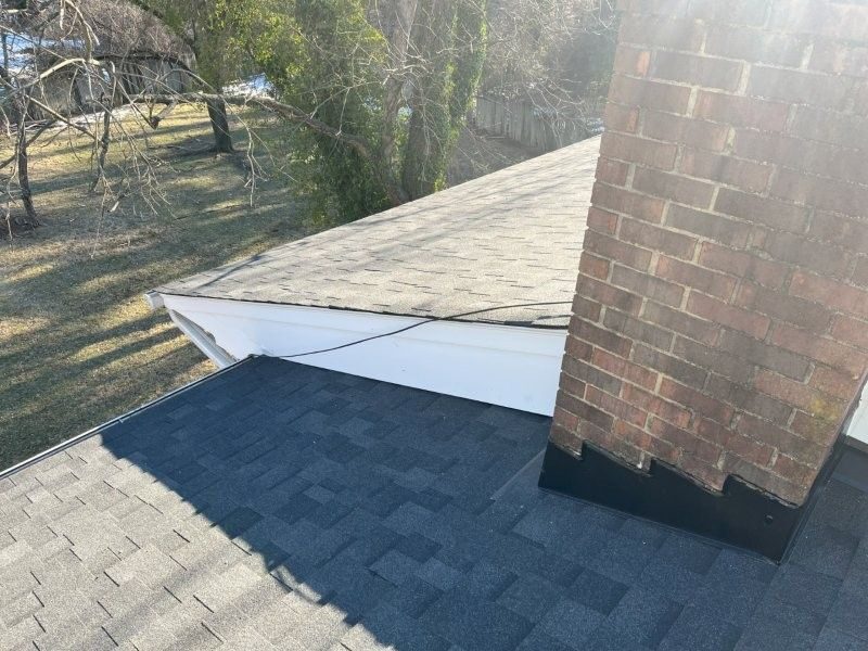 Low-slope roof section coated for waterproofing